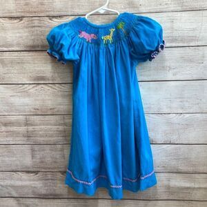 VINTAGE VIVE LA FETE SMOCKED AND‎ EMBROIDERED DRESS IN TURQUOISE CORDUROY